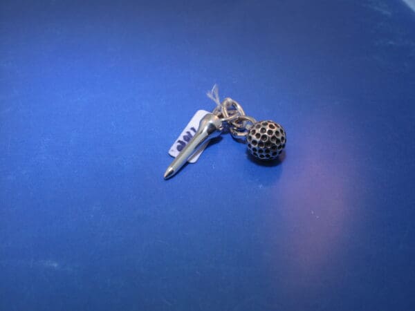 Zilveren bedel Golf tee met bal